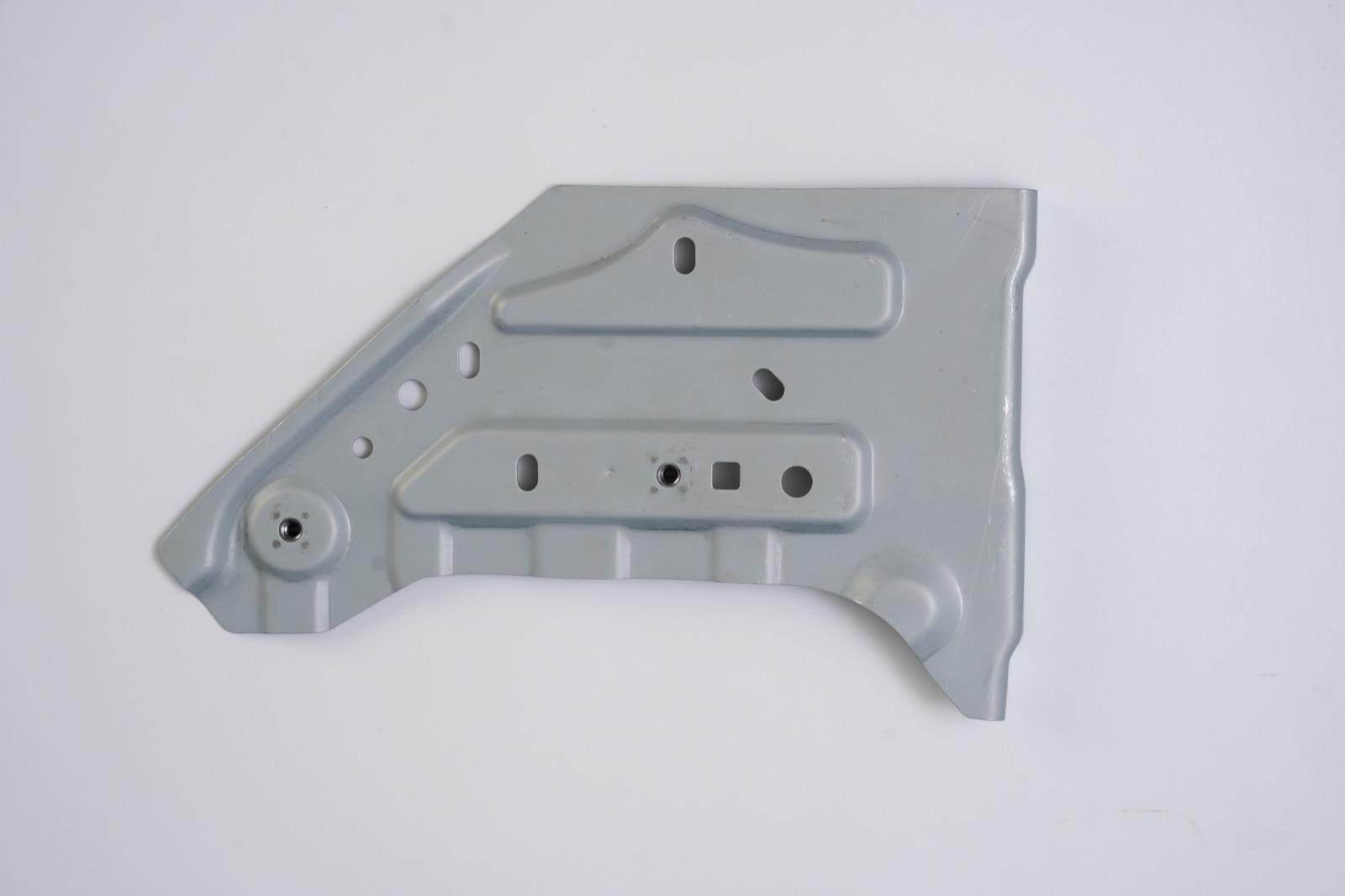 Sheet metal bracket panel with projection-welded nuts