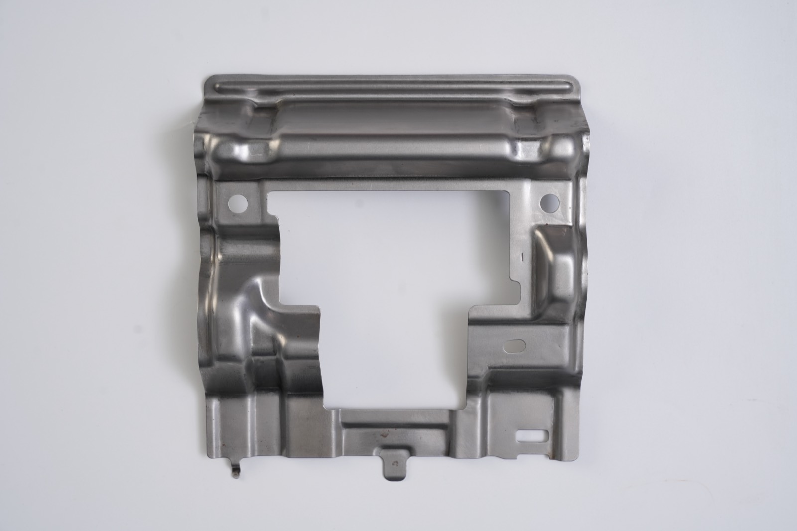 Deep-drawn frame bracket with large central cut-out and flanged edges