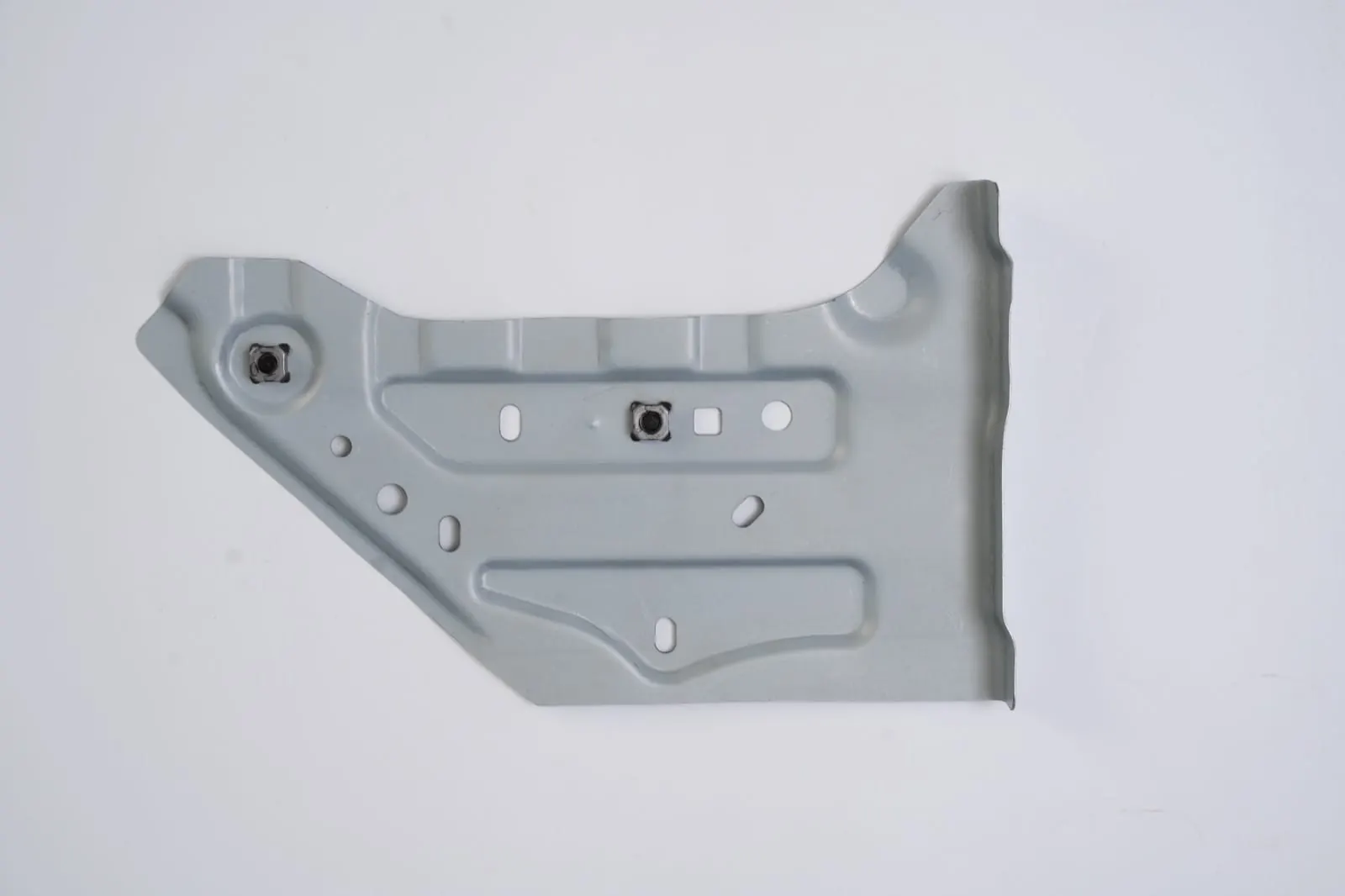 Stamped sheet metal panel with punched mounting holes
